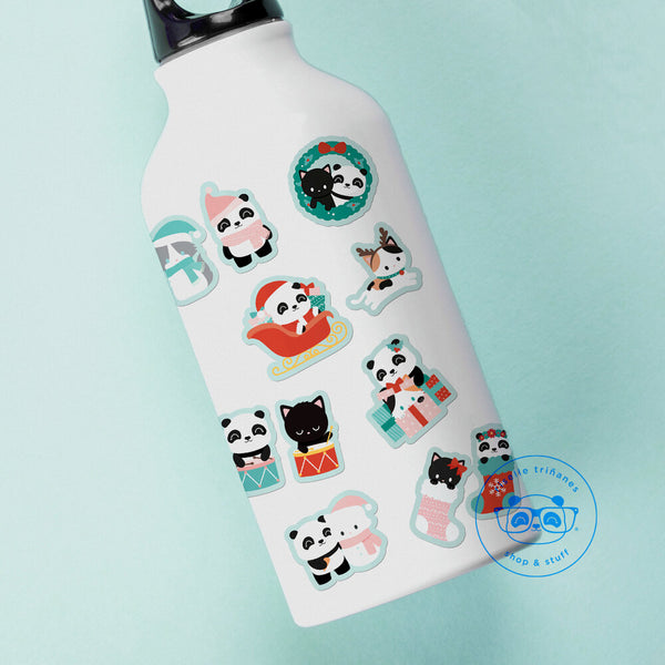 Various Pandasal and Kitten holiday themed stickers placed on a small waterbottle.